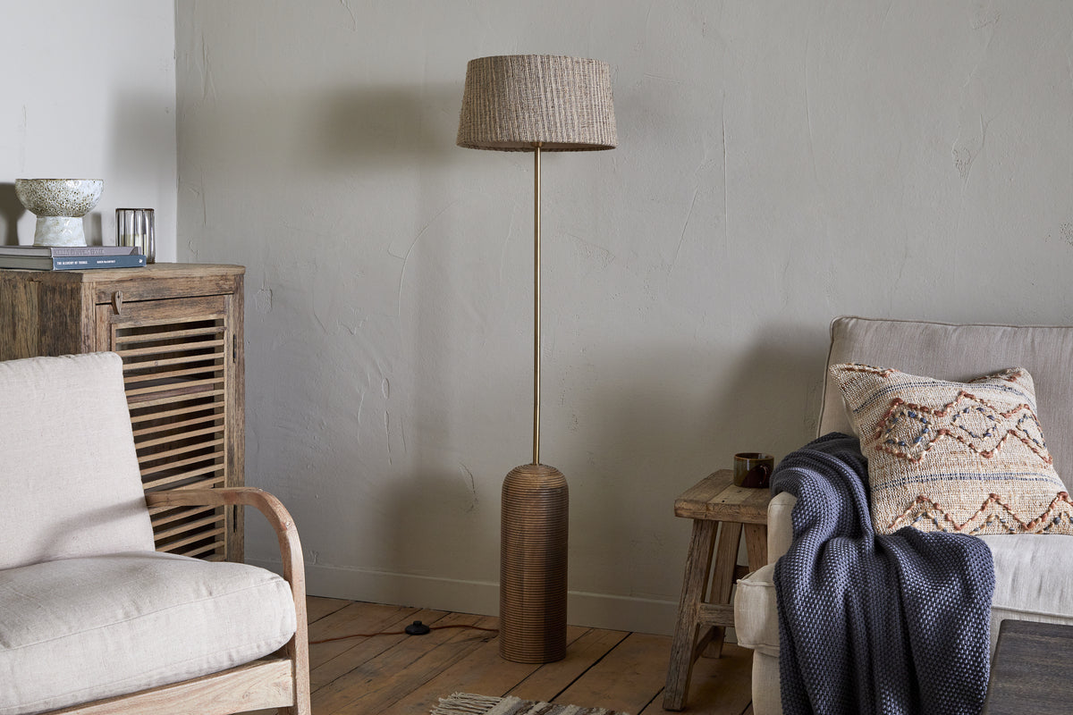 Grooved mango wood floor lamp base in a styled interior
