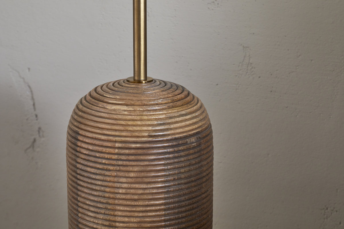 Grooved mango wood floor lamp base showing the natural wood profile
